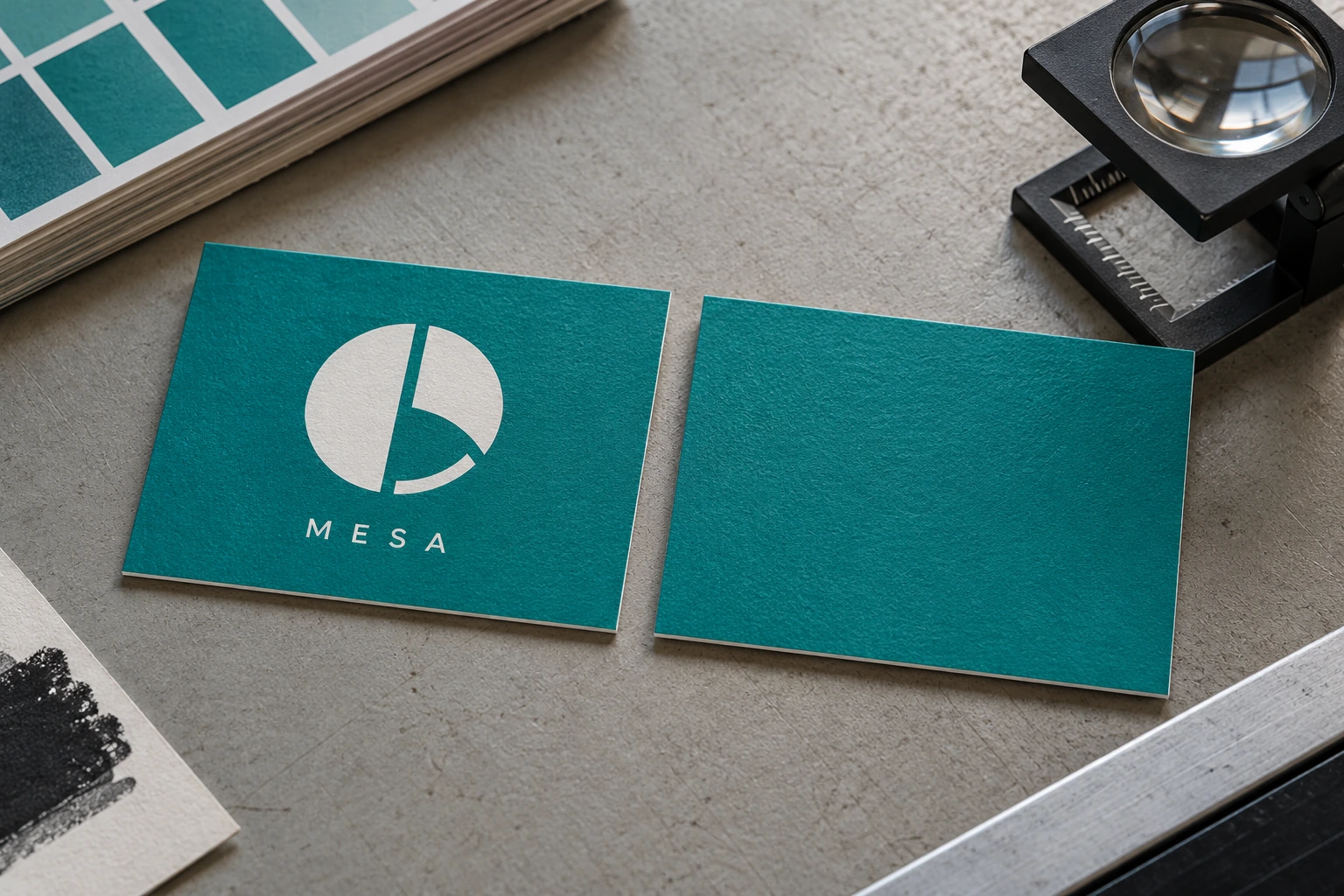 Two teal proof cards compare a visible white knockout emblem and lettering with an empty teal field.